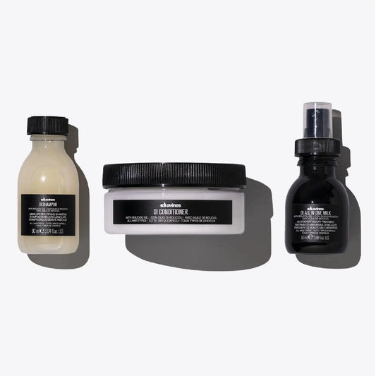 OI Travel Set including OI Shampoo, OI Conditioner, and OI All in One Milk for nourishing all hair types.