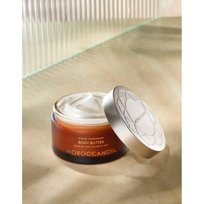 Moroccanoil body butter jar with creamy texture, designed for intense hydration and nourishment of dry skin.