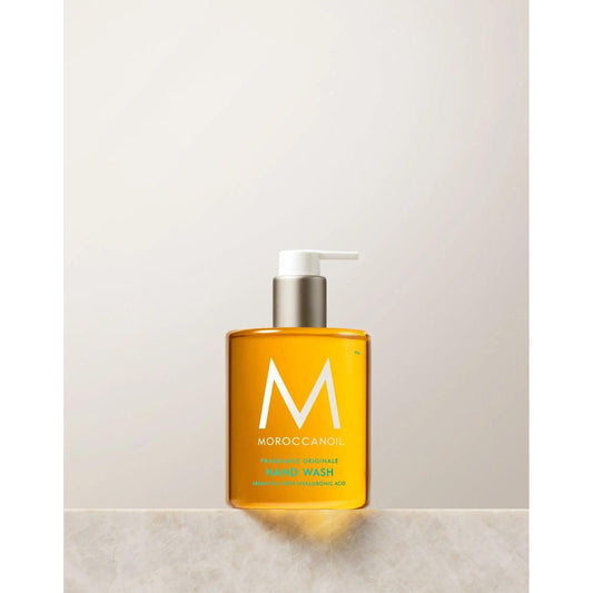 Originale Fragrance Hand Wash in a clear bottle featuring a pump, enriched with argan oil and hyaluronic acid.