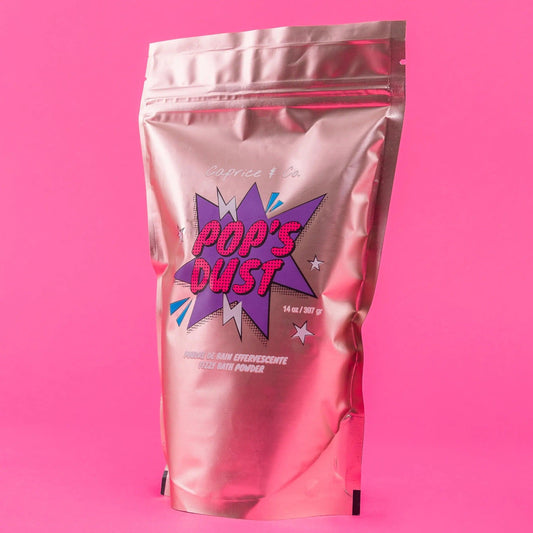 Pop's Dust fizzy bath powder package, 14 oz, vibrant design with sour candy scent, cruelty-free and plant-based ingredients.