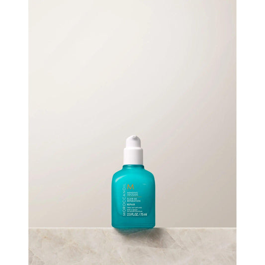 Moroccanoil's Mending Infusion styling product in a turquoise bottle on a light background.