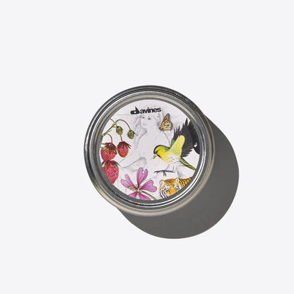 Davines Replenishing Butter jar featuring a colorful design with flowers and birds, ideal for hair and skin hydration.