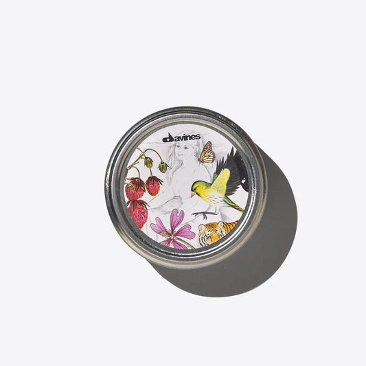 Davines Replenishing Butter jar featuring a colorful design with flowers and birds, ideal for hair and skin hydration.