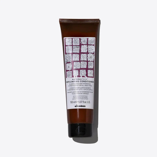 Replumping Conditioner by Davines, elasticizing and moisturizing formula for revitalizing hair structure and untangling knots.