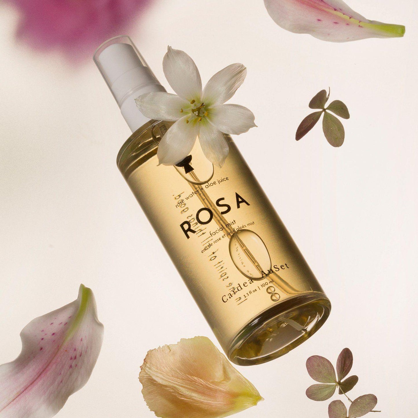 Rosa candle and body oil set with floral elements, luxury spa product with calming fragrance, perfect for relaxation and self-care.