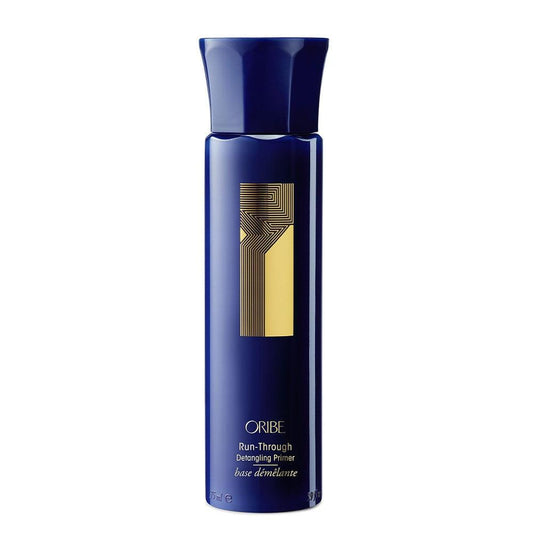 Oribe Run-Through Detangling Primer in blue and gold bottle for shiny, manageable hair