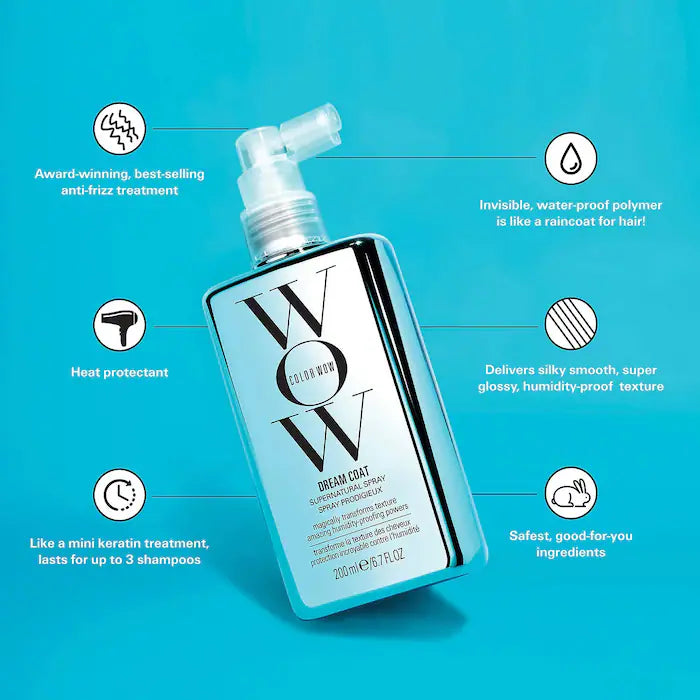Dream Coat Supernatural Spray bottle on blue background, featuring anti-frizz, heat protection, and moisture-blocking benefits.