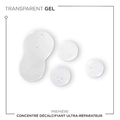 Transparent gel drops of Concentré Ultra-Réparateur for damaged hair treatment.