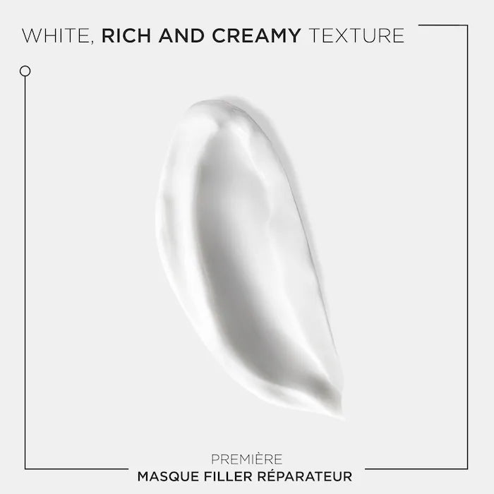 Rich white creamy texture of Masque Filler Réparateur for repairing damaged hair.