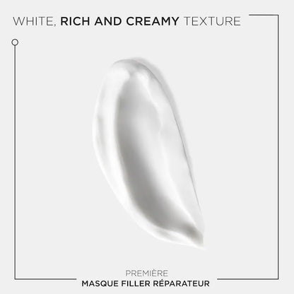 Rich white creamy texture of Masque Filler Réparateur for repairing damaged hair.