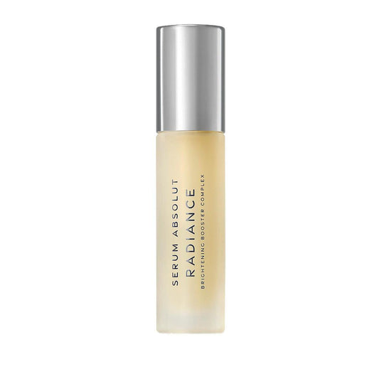 Radiance brightening serum bottle with silver cap, skincare product for glowing skin, Serum Absolut Radiance, boosting radiant complexion.