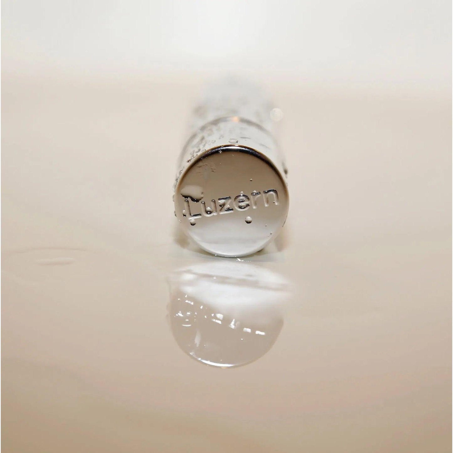 Close-up of a Lucerne skincare product with reflective surface