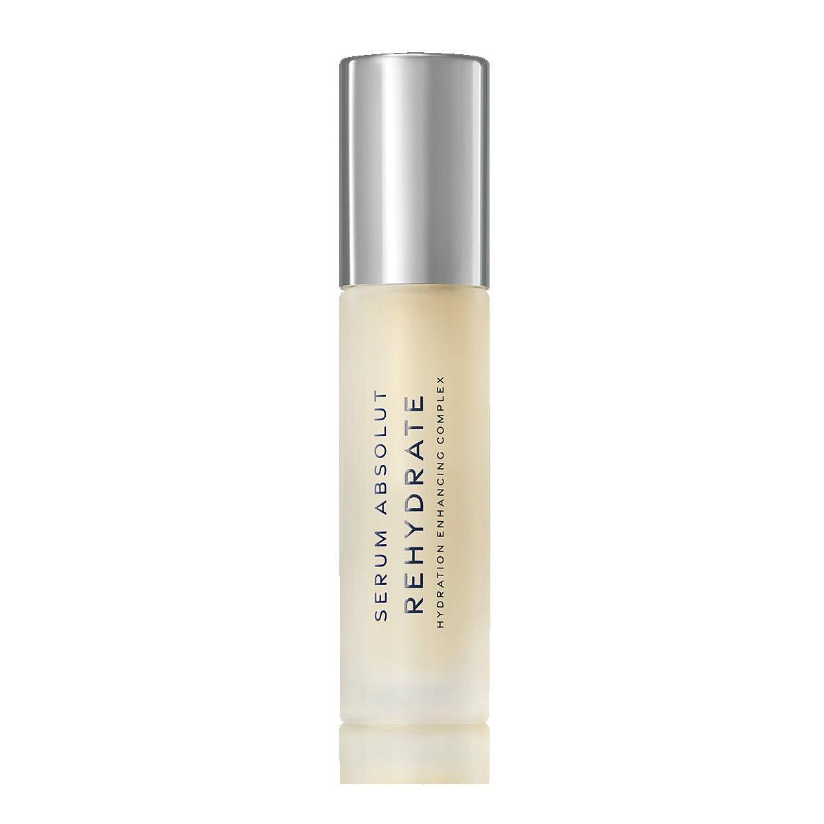 Serum Absolut Rehydrate hydrating enhancing complex in clear bottle with silver cap. Premium skincare product for moisturizing.