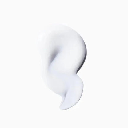 White cream skincare product with smooth texture on white background