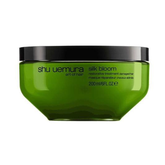 Shu Uemura Silk Bloom Restorative Treatment jar for damaged hair, 200ml, showcasing vibrant green packaging.