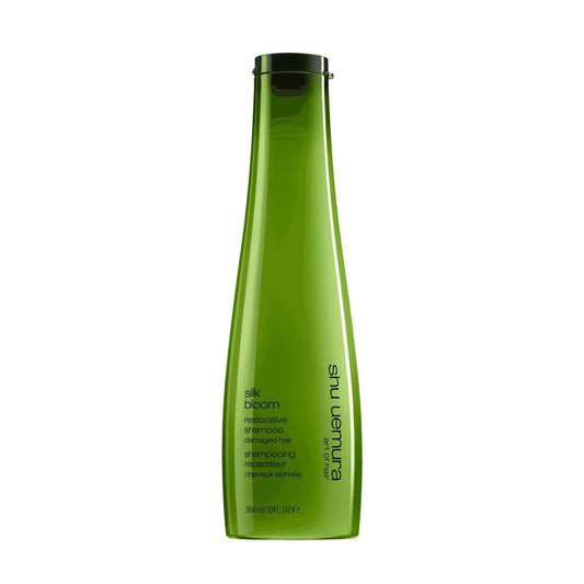 Shu Uemura Silk Bloom Shampoo bottle, a restorative formula for dry and damaged hair, 300ml size.