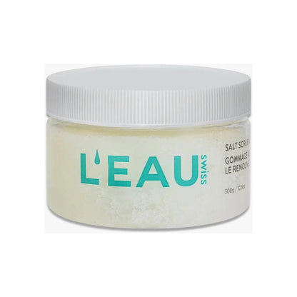 L'Eau Swiss Skin Renewal Salt Scrub in a clear jar with a white lid, promoting smooth and rejuvenated skin.