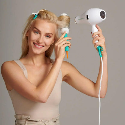 Woman styling hair with Smart Styling Infrared Hair Dryer and roller, showcasing lightweight and energy-efficient design.