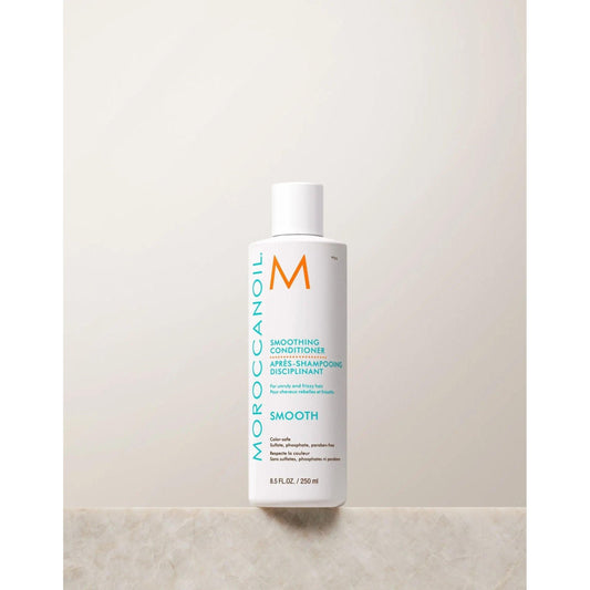Moroccanoil Smoothing Conditioner bottle designed to tame frizz and enhance hair's natural shine and softness.