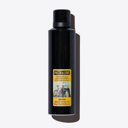 Davines Pasta & Love pre-shaving and beard oil black bottle with yellow label featuring a bicycle image, 200ml premium grooming product