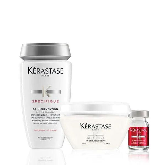 Kérastase Specifique hair care products including Bain Prevention shampoo, Masque Hydra-Apaisant, and Cure Densifique serum for hair repair and growth.