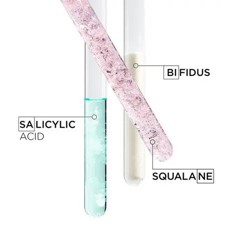 Three test tubes labeled with Salicylic Acid, Bifidus, and Squalane showcasing skincare ingredients.