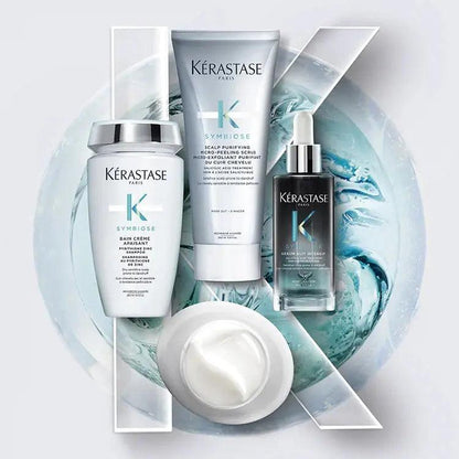 Kérastase Symbiose hair care products including serum, conditioner, and mask on a stylish blue background.