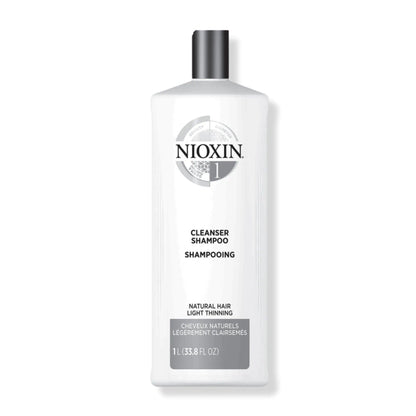 Nioxin Cleanser Shampoo System 1 for fine, thin natural hair in a 1L bottle, detoxifying for healthy growth and volume.
