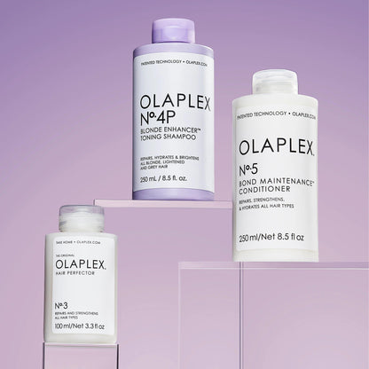 OLAPLEX Blonde Maintenance System: Nº.3 Hair Perfector, Nº.4P Shampoo, and Nº.5 Conditioner for vibrant hair.
