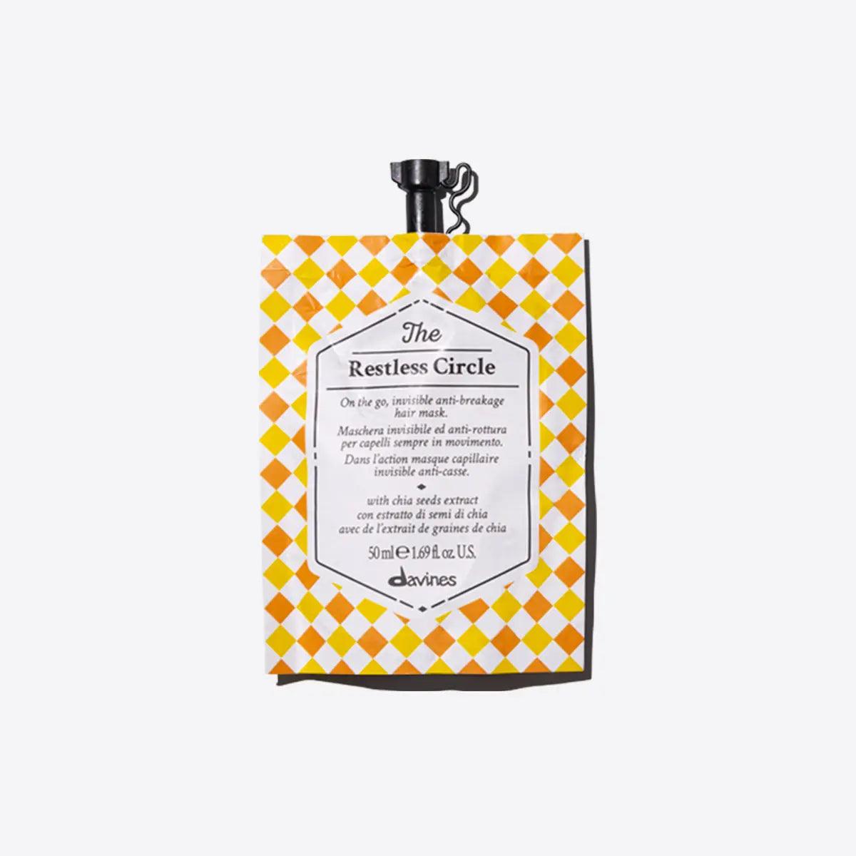 Anti-breakage hair mask called The Restless Circle in vibrant packaging, ideal for on-the-go hair care.