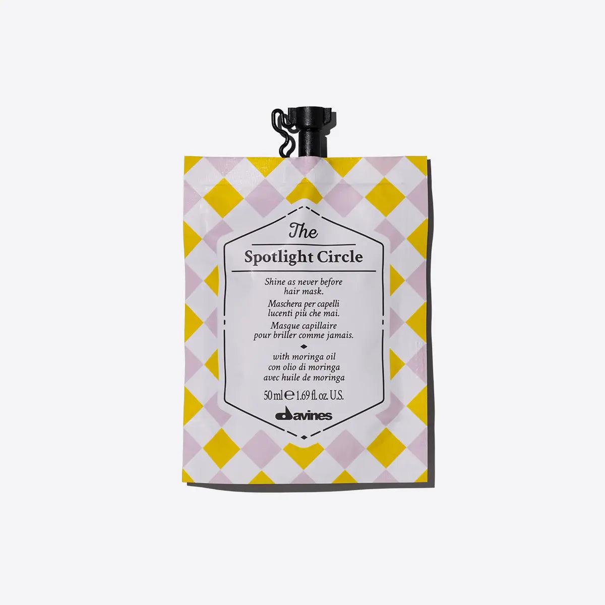 The Spotlight Circle hair mask pouch by Davines for extra shine, suitable for all hair types, enhancing color and cut.