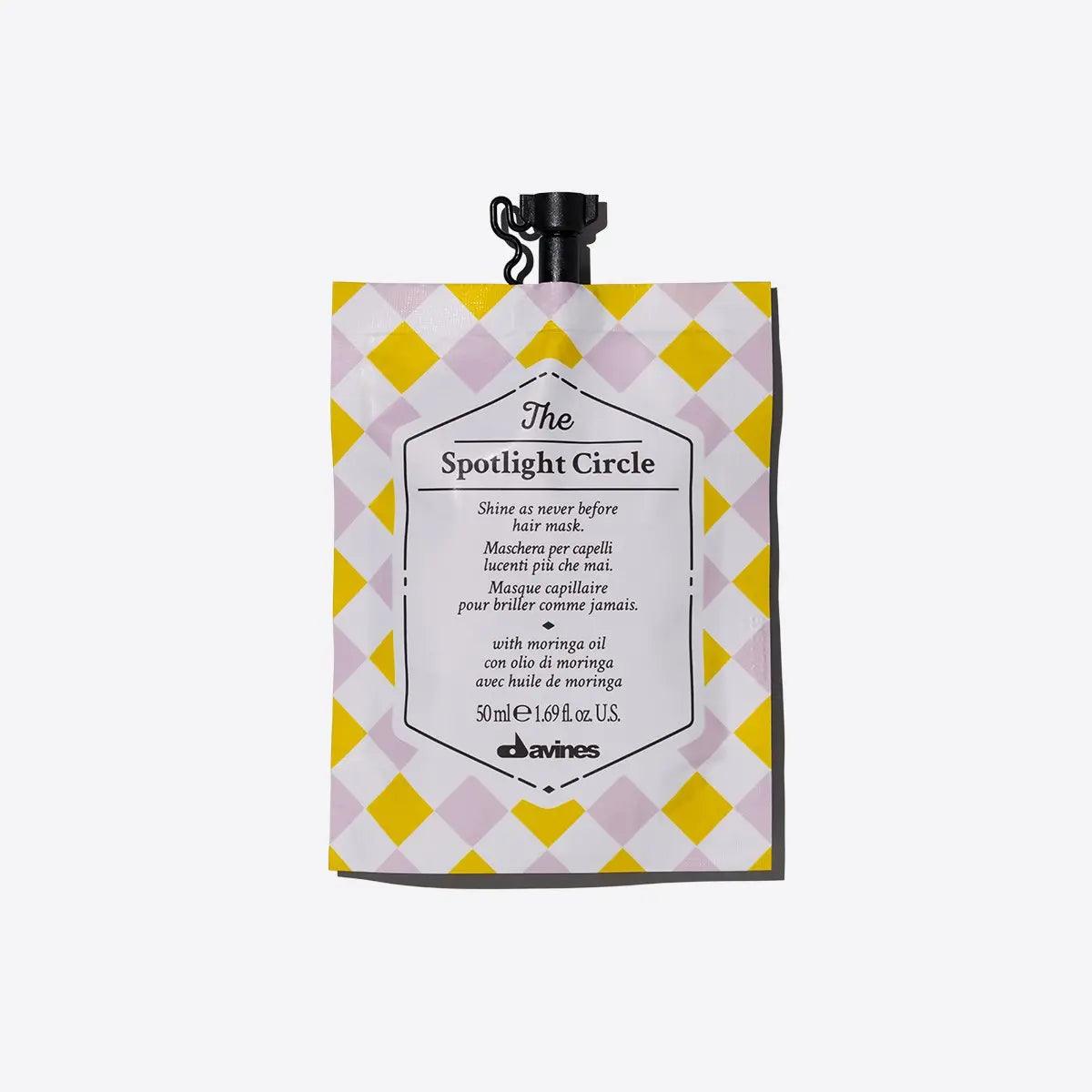 The Spotlight Circle hair treatment pouch for extra shine, suitable for all hair types, designed by Davines.