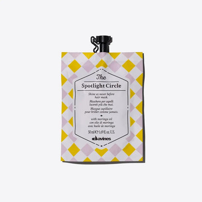 The Spotlight Circle hair treatment pouch for extra shine, suitable for all hair types, designed by Davines.
