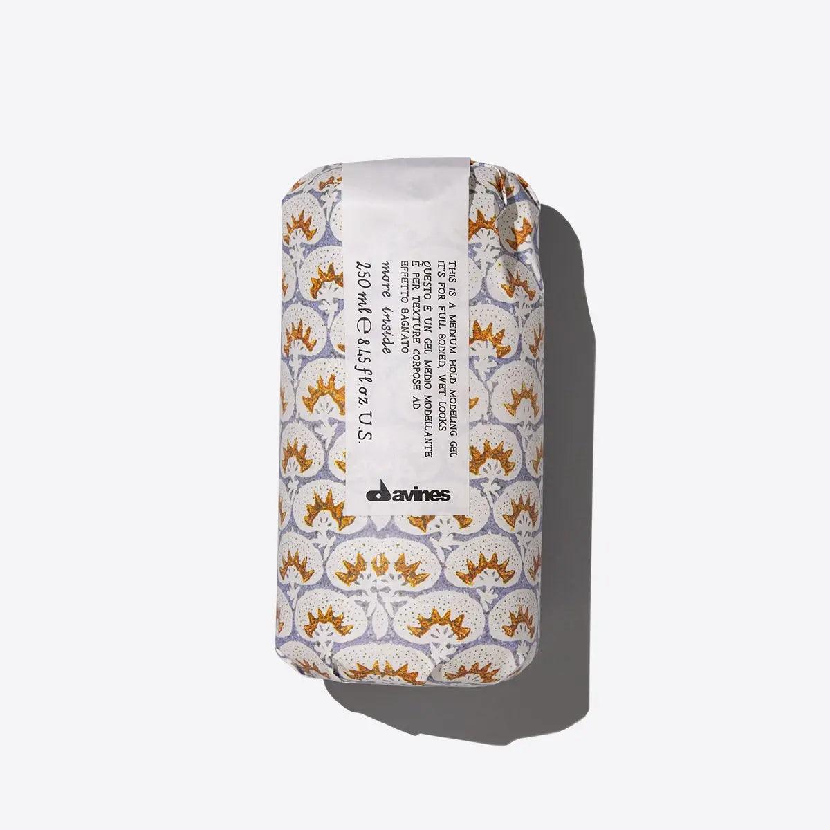 Davines hair product in printed packaging on white background