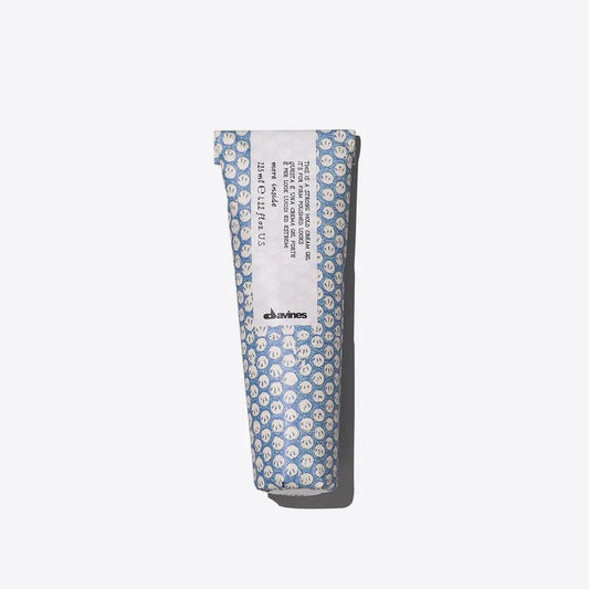 Davines hand cream in patterned blue packaging on a white background