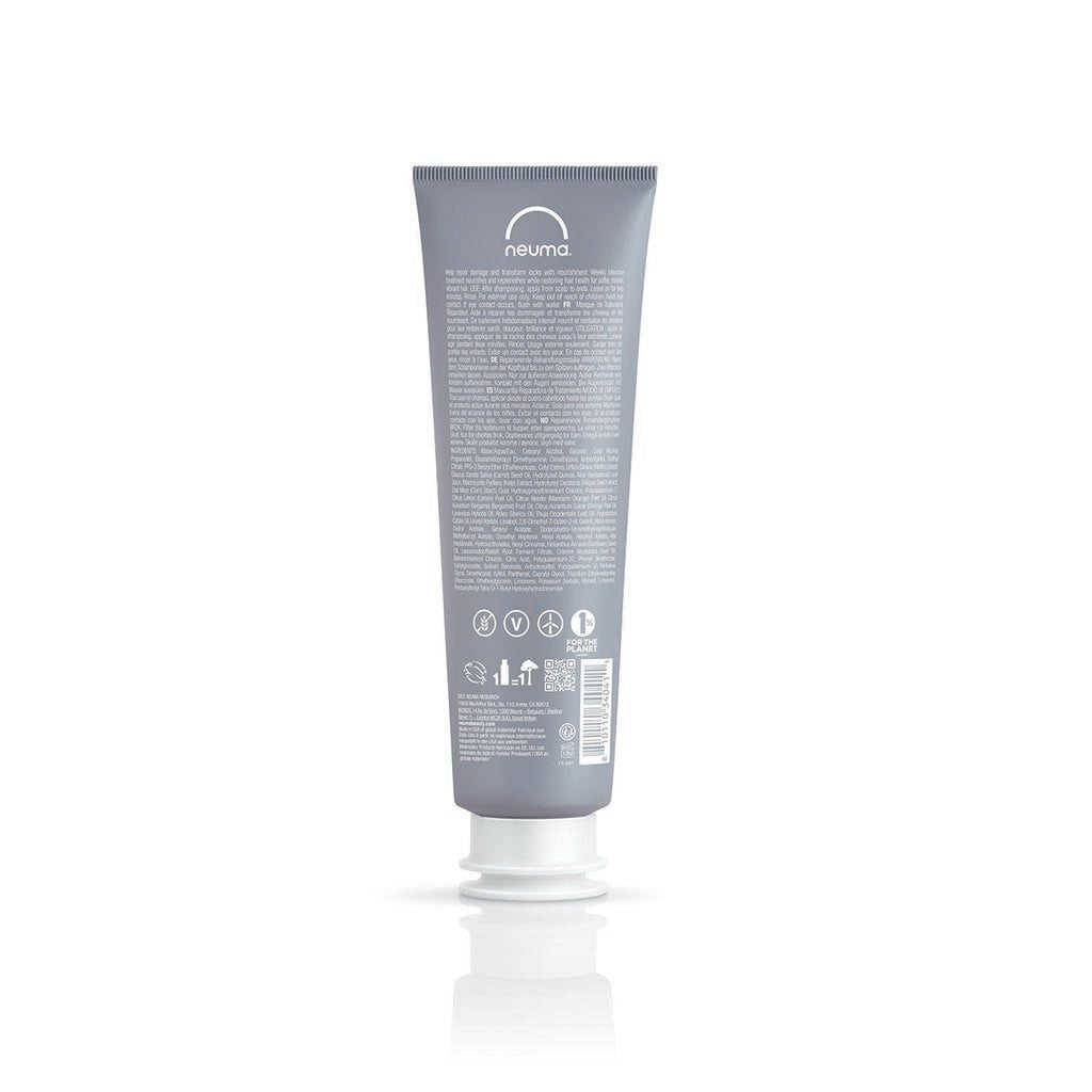 Neu Repair Treatment Masque in a gray tube, designed to nourish and restore damaged hair for softness and shine.