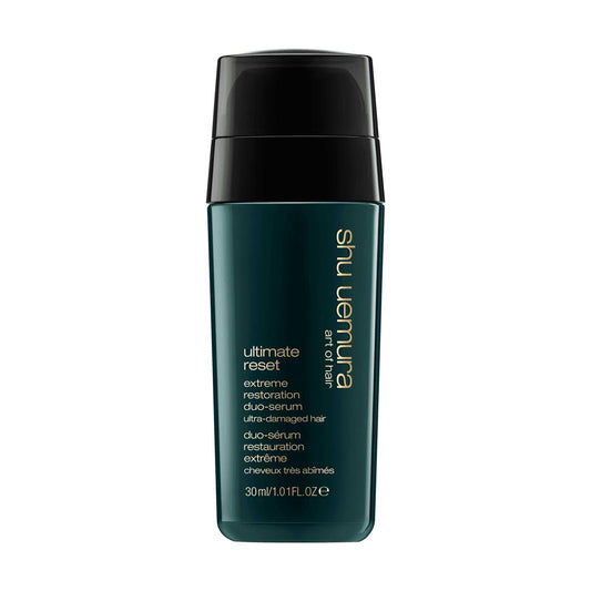 Shu Uemura Ultimate Reset Serum for extremely damaged hair in a sleek green bottle. Ideal for all textures.