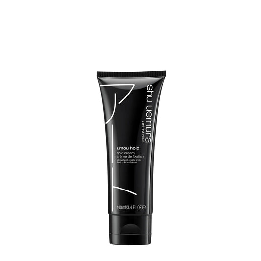 Umou Hold Cream by Shu Uemura in a black tube, providing flexible strong hold for medium to thick hair types.