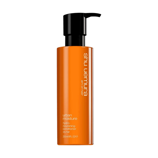 Shu Uemura Urban Moisture Conditioner in a sleek orange bottle, hydrating and nourishing dry hair for all textures.