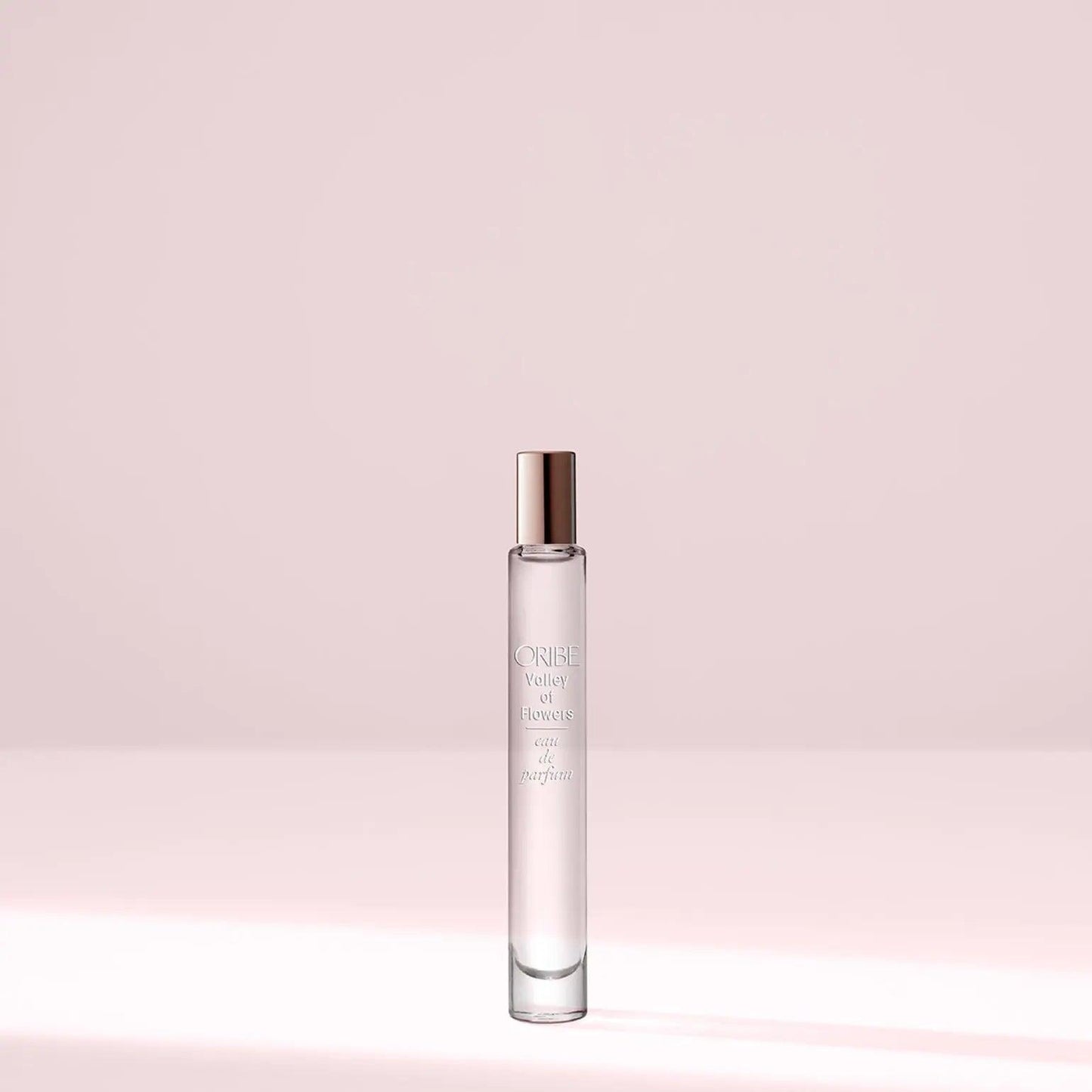 Valley of Flowers Eau De Parfum travel size bottle on a soft pastel background.