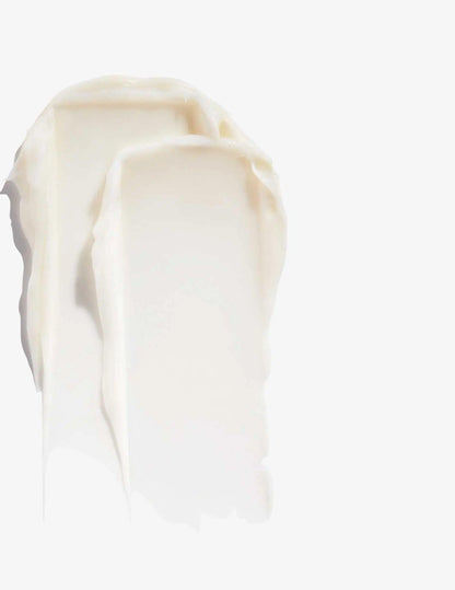 Creamy texture of Redken Volume Injection Conditioner showcasing its lightweight formula for fine hair.
