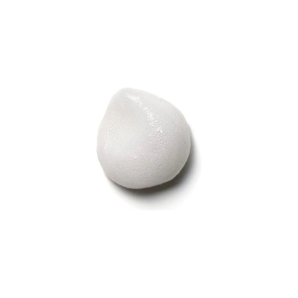 White foam texture of Moroccanoil® Volume Root Boost, designed for root lift and added hair volume.