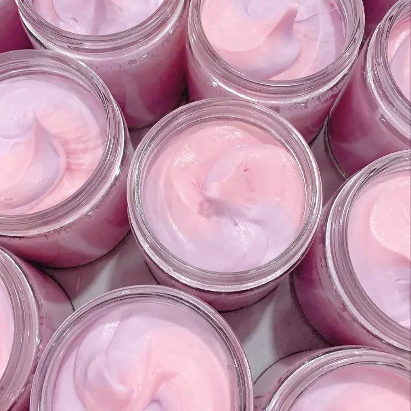 Luxurious bubblegum scented whipped soap in clear jars, showcasing a soft pink color and creamy texture.